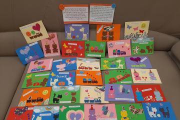 Kartki z okazji dnia dziecka przedstawijące baloniki, misie, słoniki, słońca, pociągi oraz życzenia.